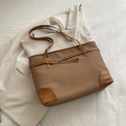 Retro patchwork tote bag with bucket silhouette, shown as a versatile everyday women's shoulder bag