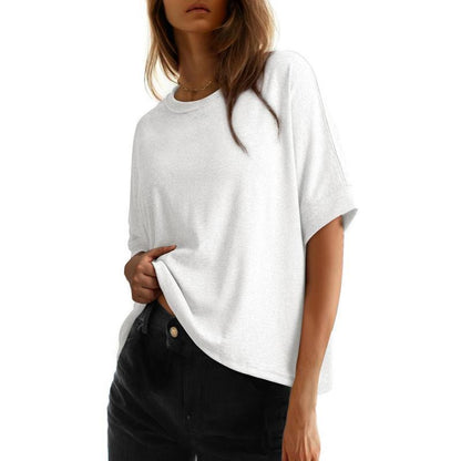 Women's batwing sleeve loose fit cotton top in light grey shown from a side angle, relaxed casual style