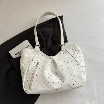 Side view of a large capacity canvas tote shoulder bag for women showing sturdy handles and spacious interior depth.