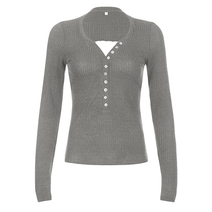 Women's color block knit pullover top with contrasting panels, shown from the back in a relaxed everyday style