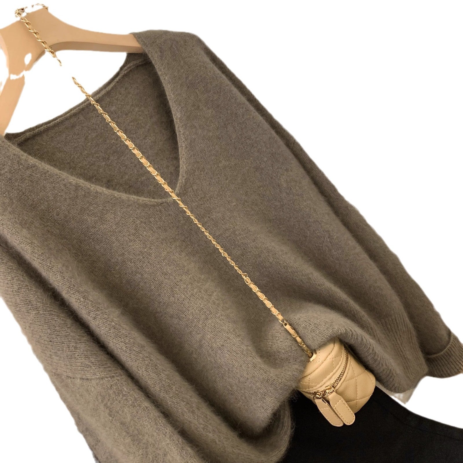 Women's loose fit crochet lace trim pullover sweater with long sleeves and elegant v-neck, shown in a relaxed everyday style