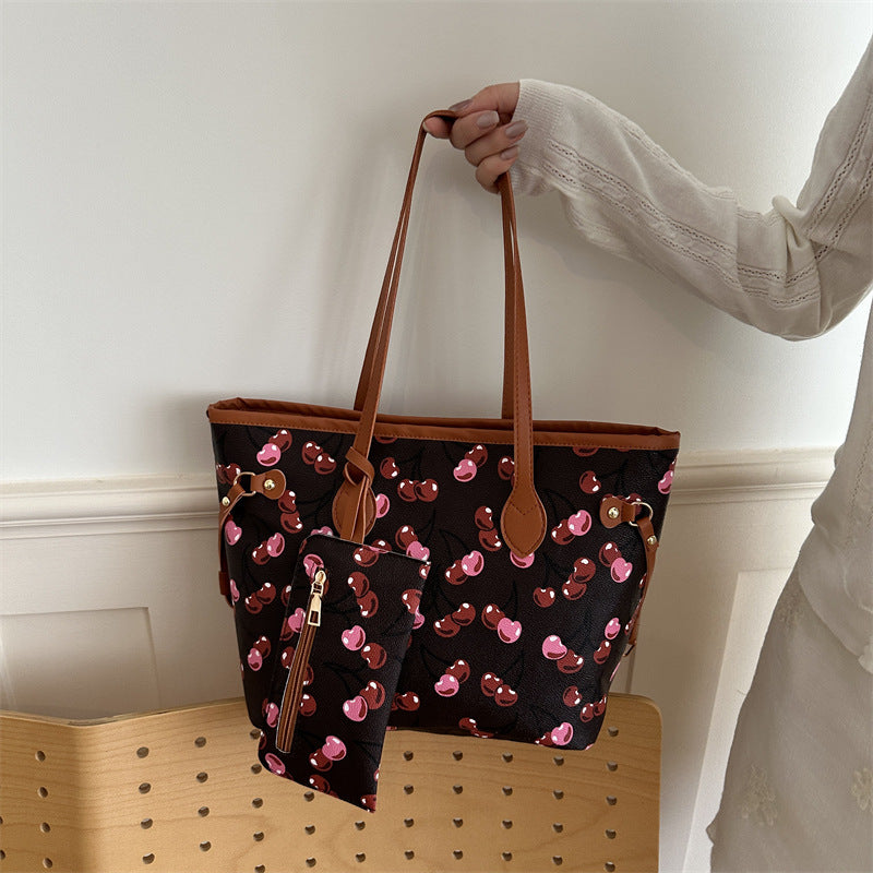 Large capacity women's tote bag with underarm strap, shown from the side to highlight its spacious structured design