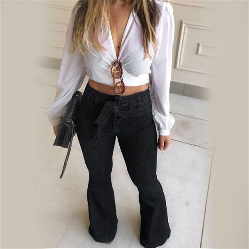 High waist wide leg denim pants with flared silhouette and lace-up detail, shown from the front