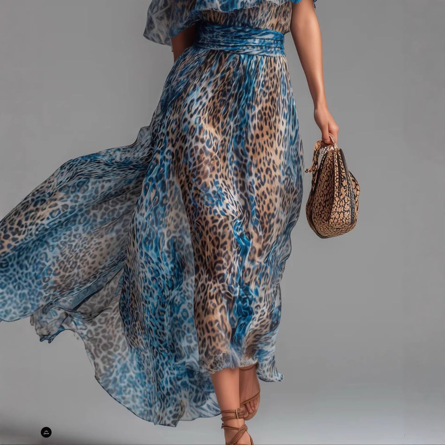 Blue leopard print chiffon off-shoulder boho A-line dress shown from the side, highlighting the flowy skirt and neckline deta