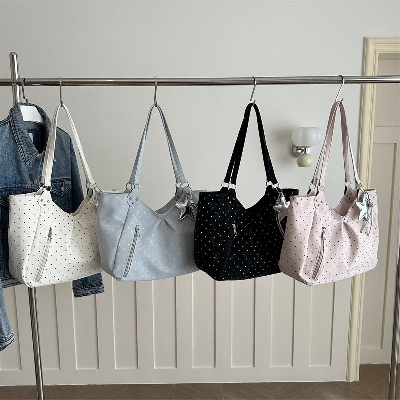 Spacious canvas tote shoulder bag for women shown from the side, highlighting roomy interior and sturdy handles
