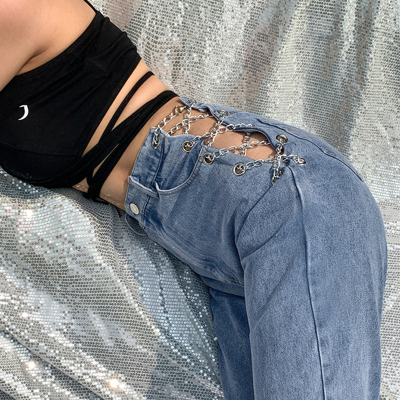 Women's high waist straight leg jeans with decorative chain detail at the waist, shown from a side angle