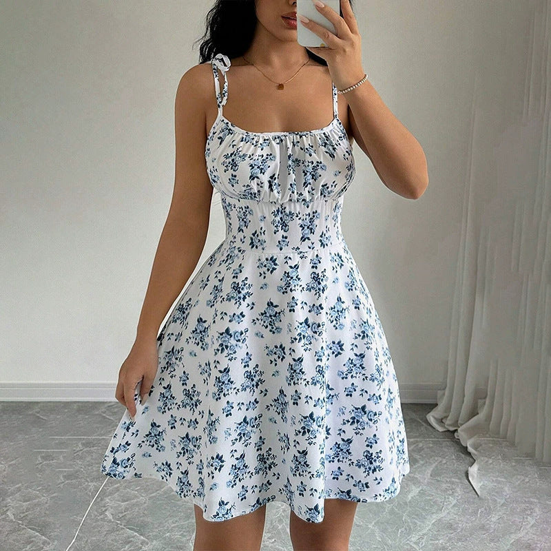 Women's floral print A-line midi dress with a casual summer style, shown in a close-up detail view