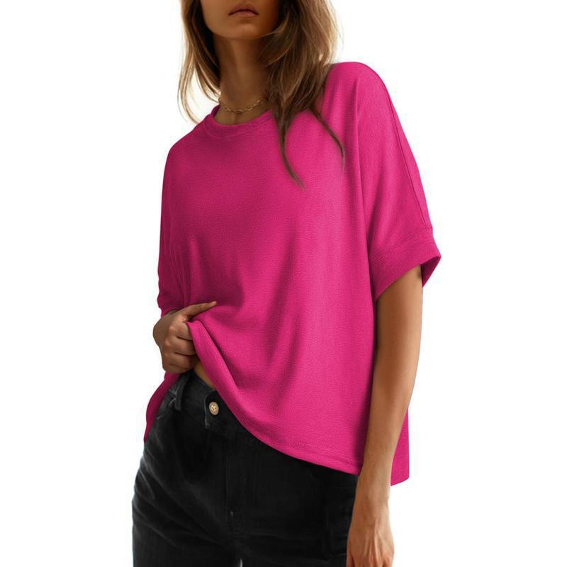 Women's batwing sleeve cotton casual top in a relaxed loose fit, shown from the side to highlight the draped silhouette.
