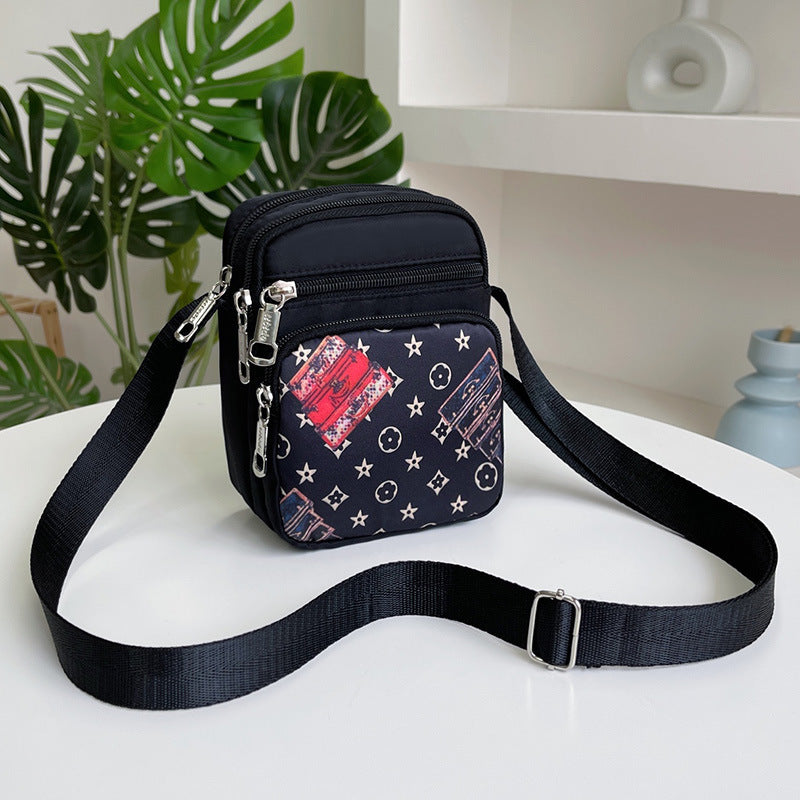 Women's waterproof casual shoulder bag shown from a side angle, highlighting the zipper closure and structured silhouette for