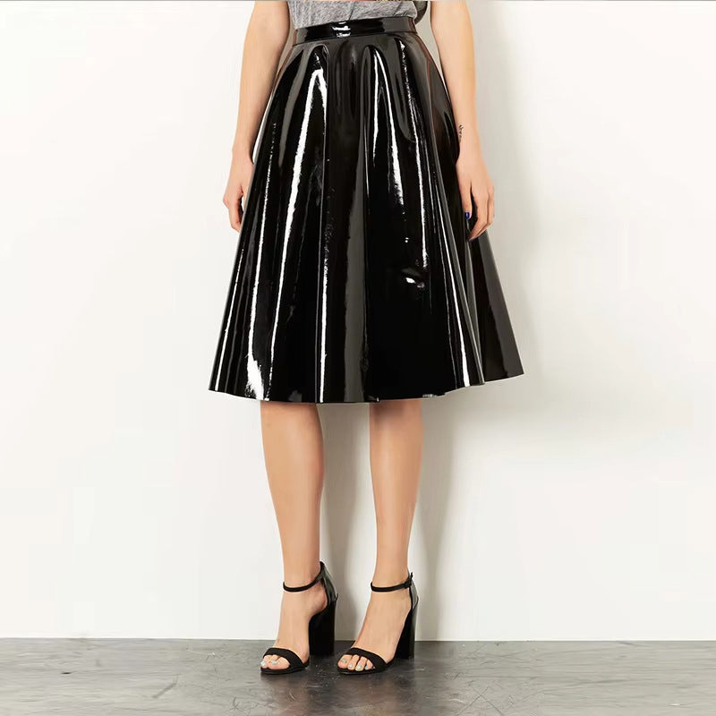 Black mirror-finish PU leather pleated midi skirt with a glossy surface, highlighting the structured pleats and sleek silhoue
