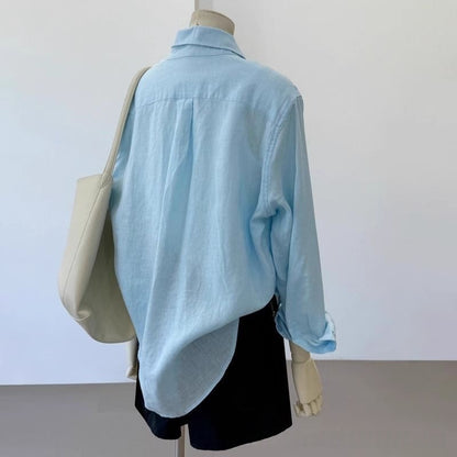 Light blue loose linen long sleeve shirt for women, shown from the back with relaxed fit and casual everyday style