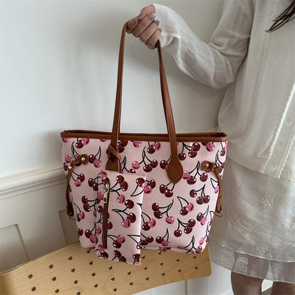 Spacious women's tote bag with underarm strap shown from the side, highlighting its large capacity and structured silhouette