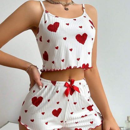 Heart print ribbed suspender shorts pajama set laid flat, showing elastic straps and soft lounge fabric detail