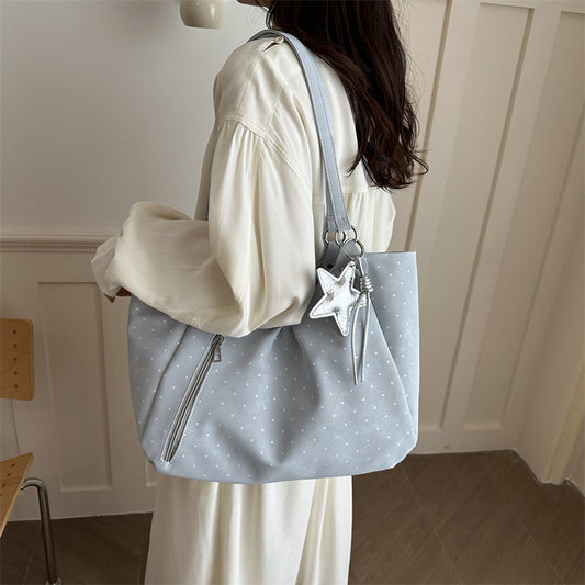 Spacious canvas tote shoulder bag for women with sturdy handles, ideal as an everyday carry bag