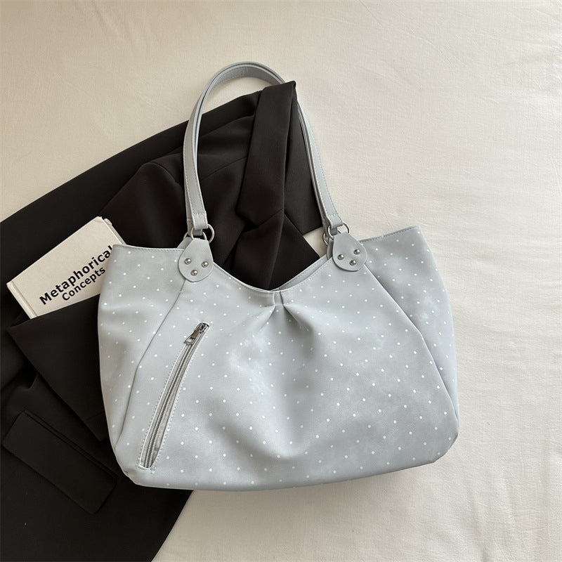 Close-up of canvas tote bag interior showing spacious main compartment and inner pockets for organized everyday carry
