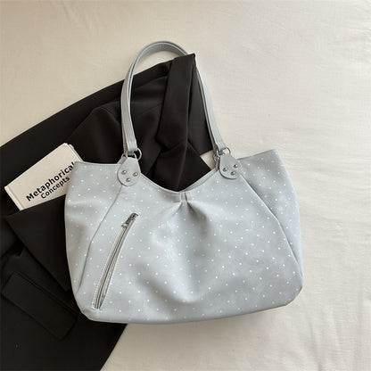 Close-up of canvas tote bag interior showing spacious main compartment and inner pockets for organized everyday carry