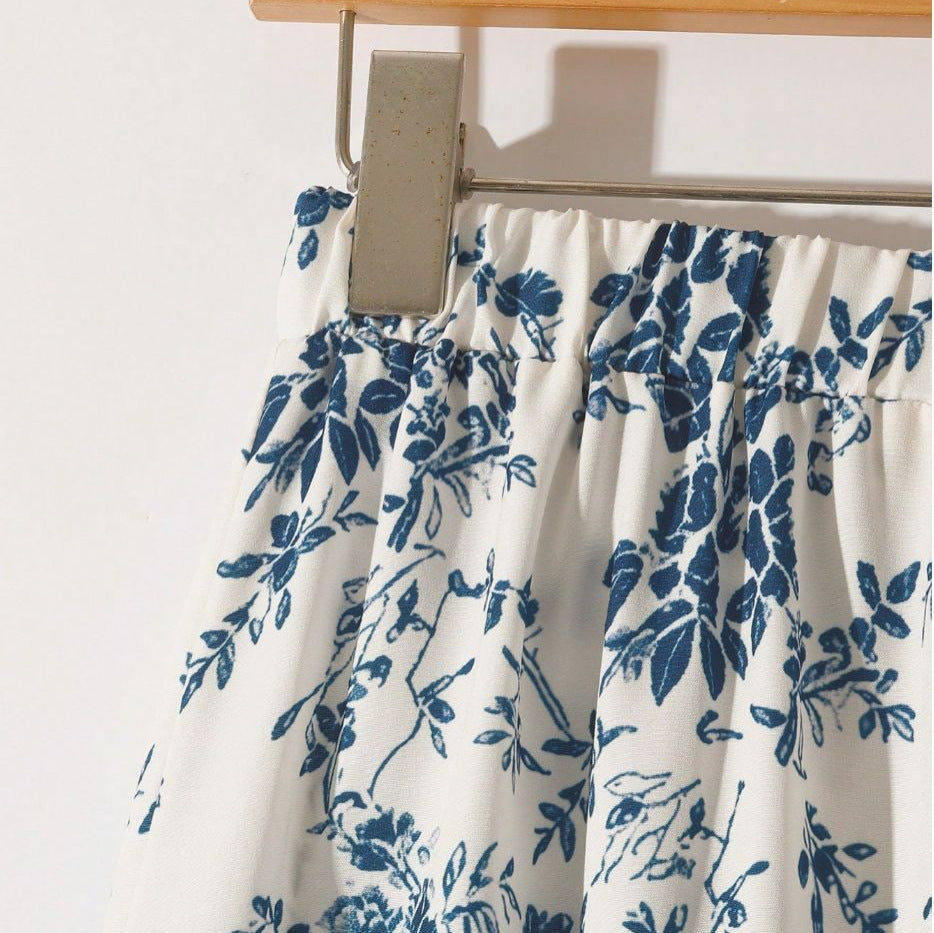 Women's high-waisted floral midi skirt with a flared A-line silhouette, shown in a close-up detail view of the print.