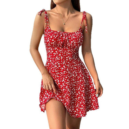Women's floral print A-line midi dress with a flowing skirt, shown in a casual summer style