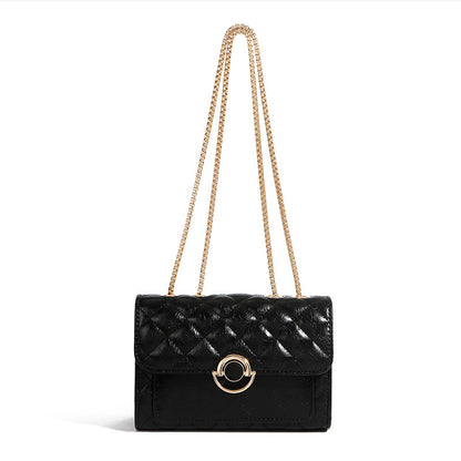 Minimalist PU crossbody bag with gold chain strap, shown in a neutral tone with clean structured silhouette