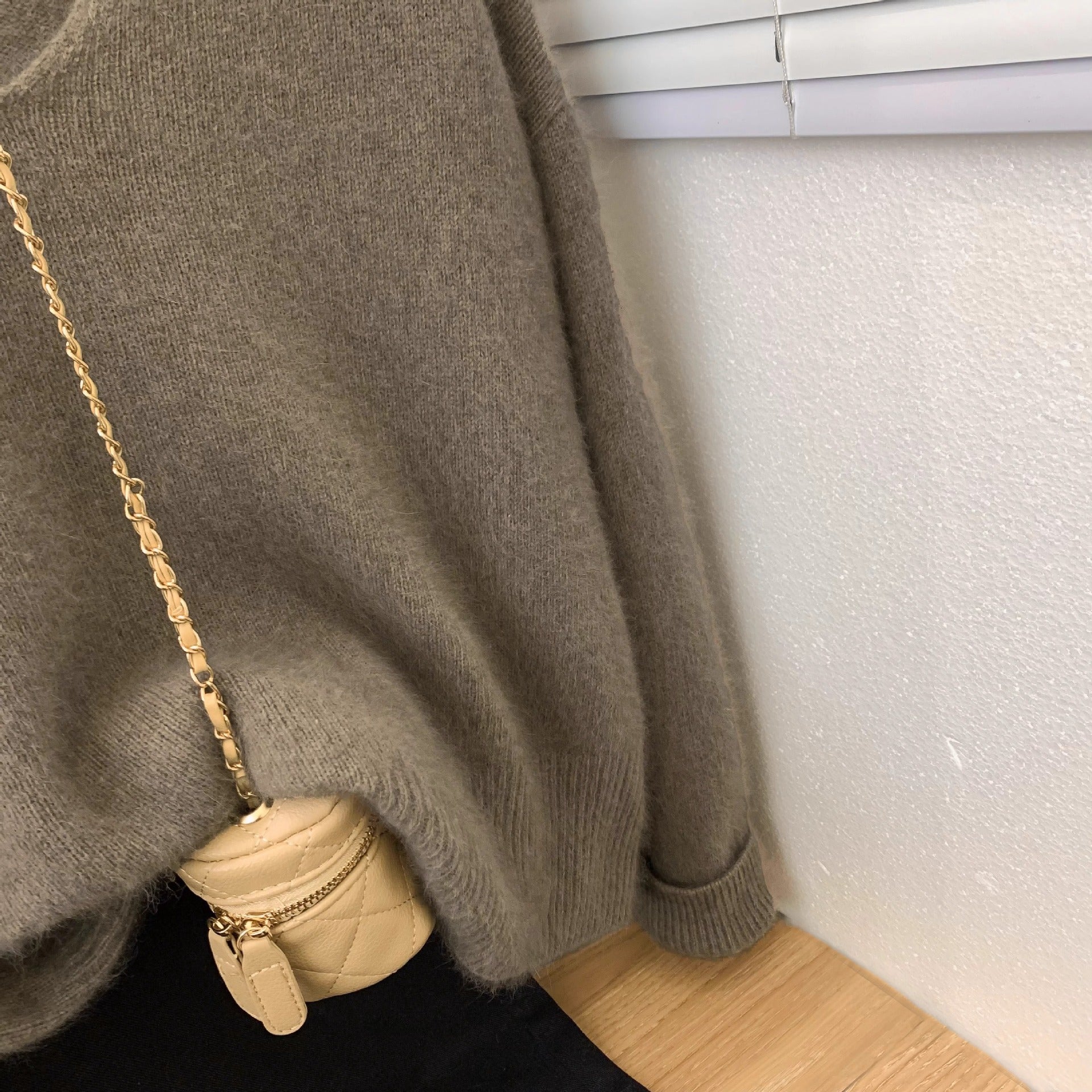 Women's loose fit v-neck pullover sweater featuring crochet lace trim neckline and long sleeves in an elegant casual style