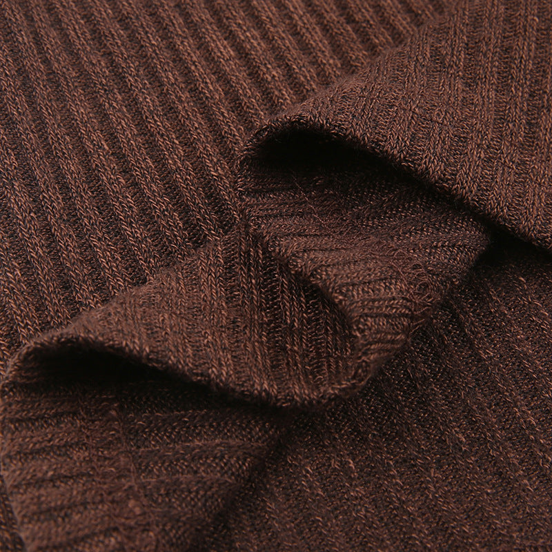 Women's color block knit pullover top shown from the back, highlighting the contrasting panel design and relaxed fit