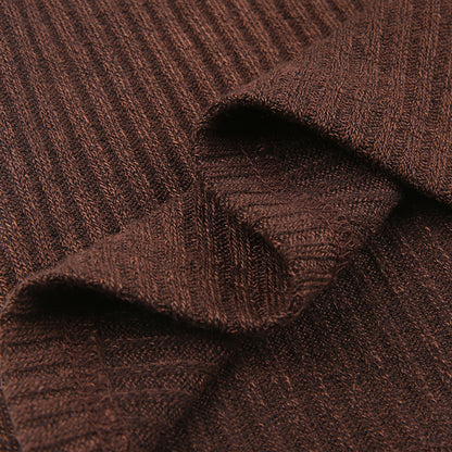 Women's color block knit pullover top shown from the back, highlighting the contrasting panel design and relaxed fit