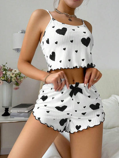 Women's heart print ribbed suspender shorts pajama set shown in a close-up detail view of the fabric texture and pattern