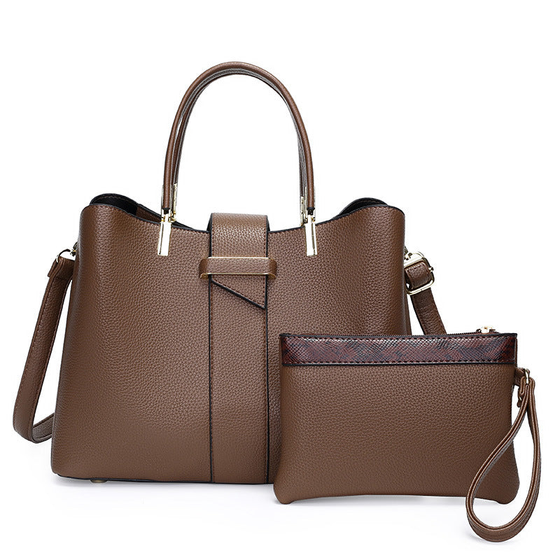 Retro bucket handbag with detachable crossbody strap shown from a close-up angle highlighting stitching and hardware details