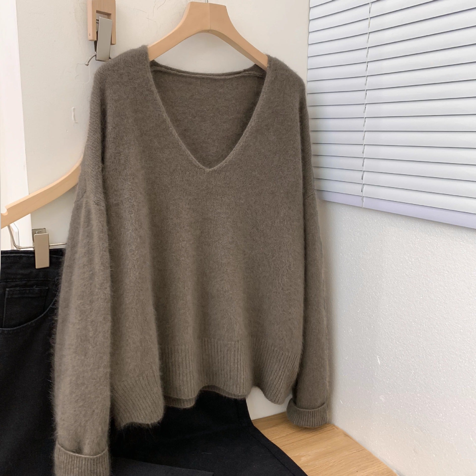 Women's loose fit v-neck pullover sweater with crochet lace trim, long sleeves, soft knit fabric in a relaxed silhouette