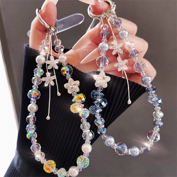 Crystal beaded phone lanyard bracelet with card holder and tassel charm, styled as a wrist strap accessory