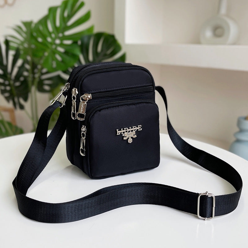 Women's waterproof casual shoulder bag shown from a close detail angle, ideal for everyday carry