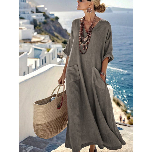 Boho floral kaftan maxi dress with V-neck, loose fit silhouette, and patch pockets, shown from the front