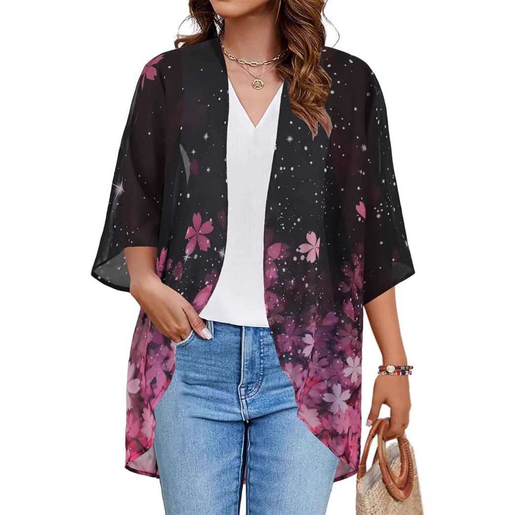 Sheer floral chiffon cardigan beach cover-up draped open, showing lightweight sun-protective fabric in a relaxed boho blouse 