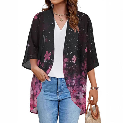 Sheer floral chiffon cardigan beach cover-up draped open, showing lightweight sun-protective fabric in a relaxed boho blouse 