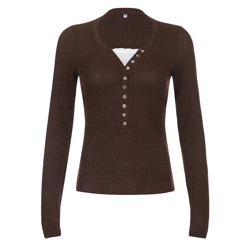 Women's color block knit pullover top shown from the back, highlighting contrast panel design and relaxed fit