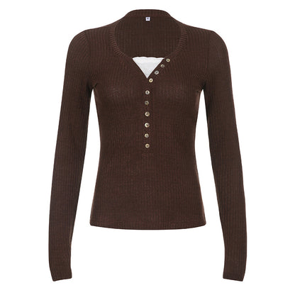 Women's color block knit pullover top shown from the back, highlighting contrast panel design and relaxed fit