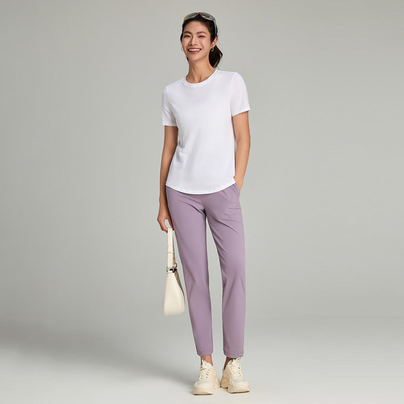 Women's loose straight-leg cropped pants with an elastic drawstring waist, shown in a relaxed casual style