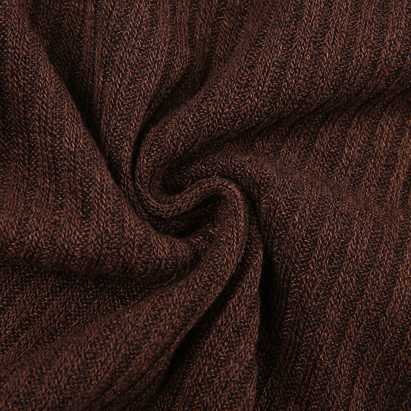 Women's color block knit pullover top shown in a close-up detail view highlighting the textured fabric and bold color panels.