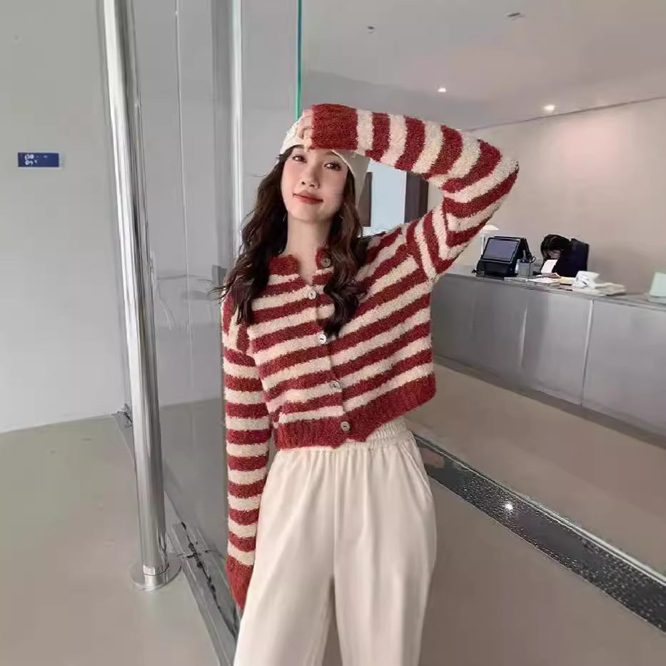 Women's chunky knit short cardigan sweater in a relaxed cropped fit, featuring thick ribbed texture and open front style.