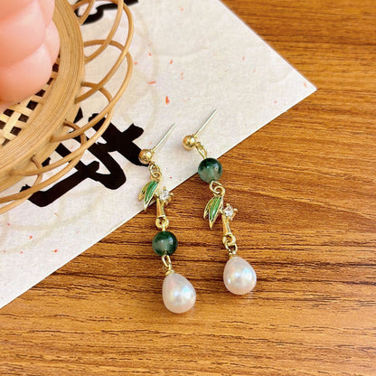 Bamboo leaf pearl drop earrings in vintage Chinese style, featuring retro alloy detailing and elegant dangling pearls.