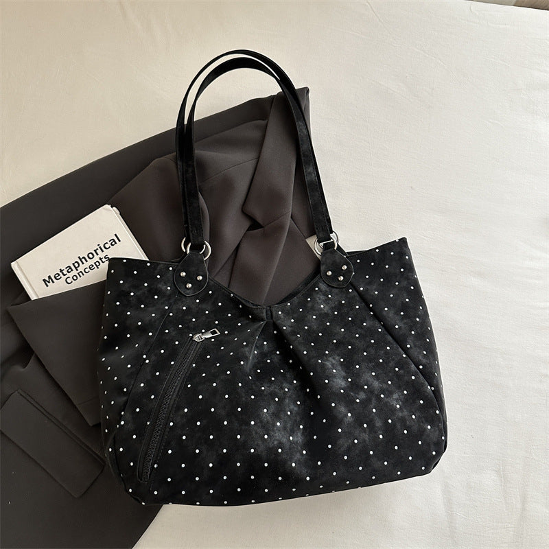 Spacious canvas tote shoulder bag for women shown from the side, highlighting roomy interior and sturdy handles