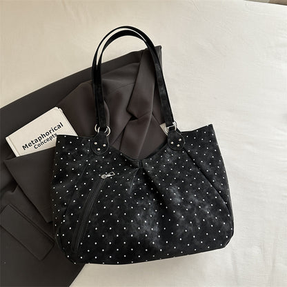 Spacious canvas tote shoulder bag for women shown from the side, highlighting roomy interior and sturdy handles