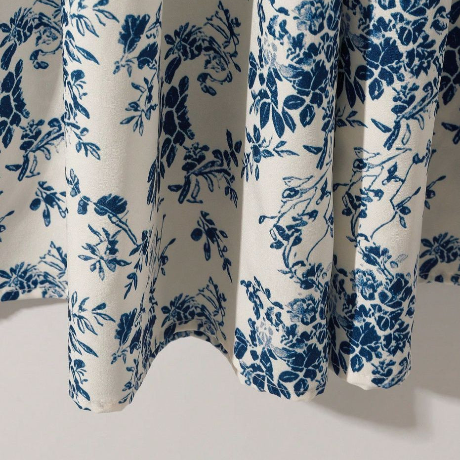 Women's high-waisted floral print midi skirt with a flared A-line silhouette, shown in a close-up detail view