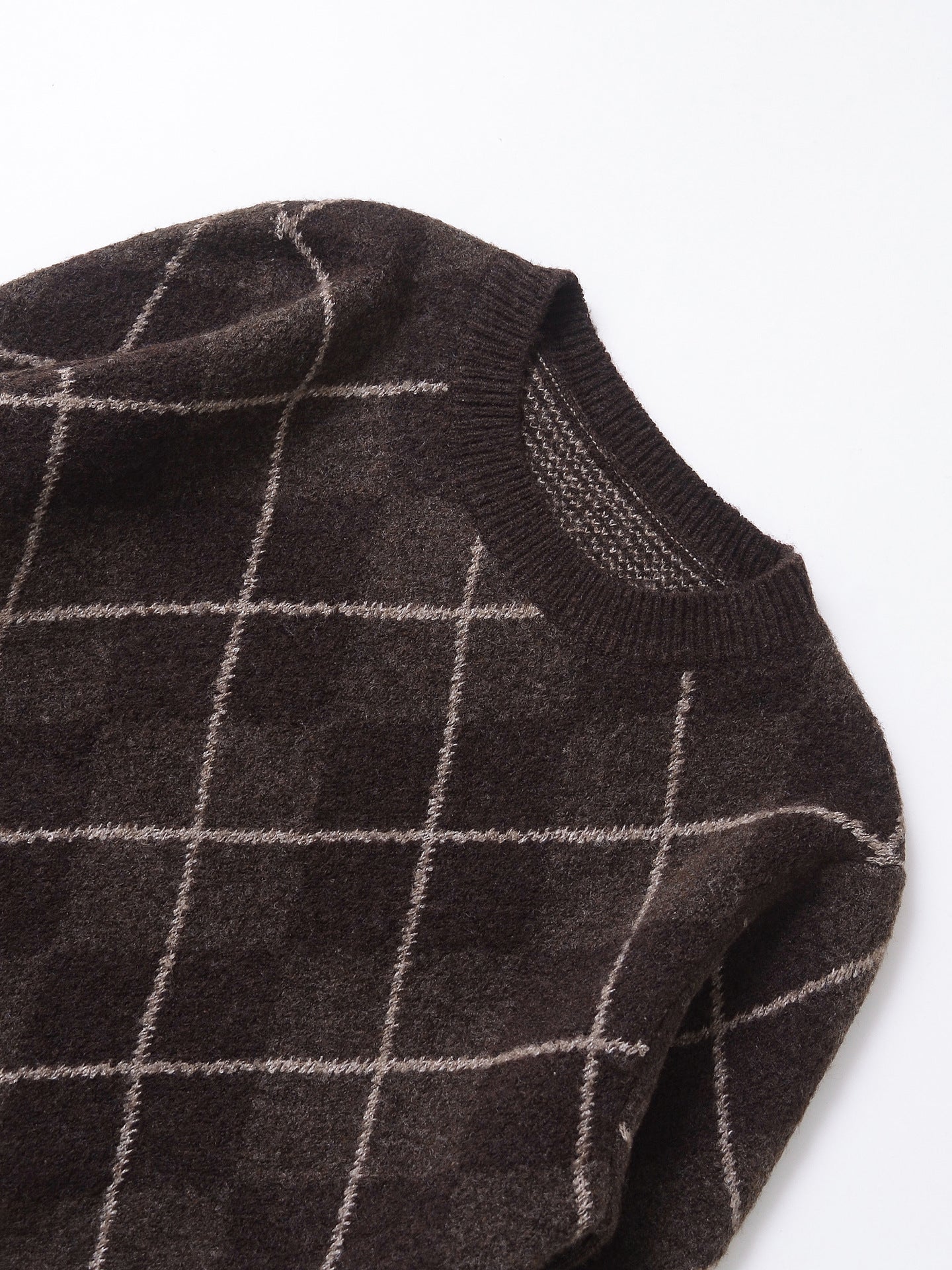 Women's coffee brown crew neck knit sweater with diamond plaid pattern, shown in a close-up detail view