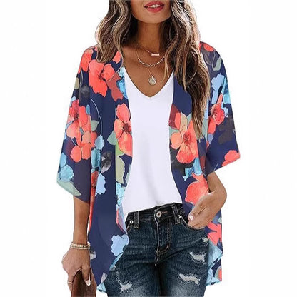 Sheer floral chiffon cardigan beach cover-up draped open, showing lightweight sun-protective fabric in a relaxed boho style