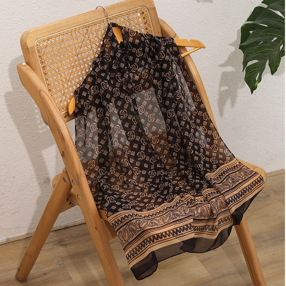 Coffee brown French vintage geometric woven shawl scarf folded flat, showing retro pattern detail