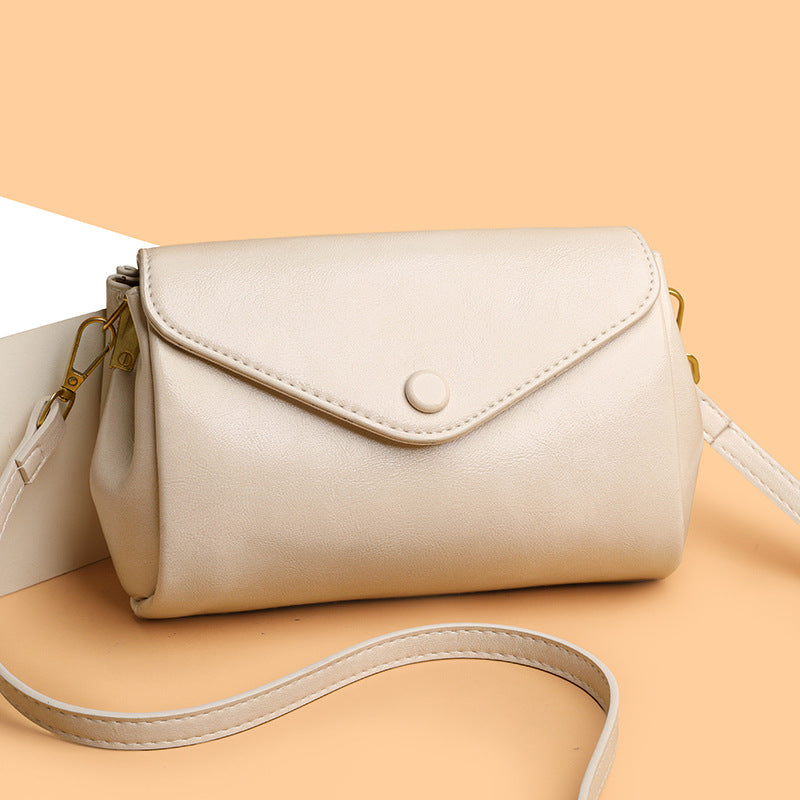 Retro Commuter PU leather crossbody bag open to show multiple interior compartments, ideal for everyday urban use