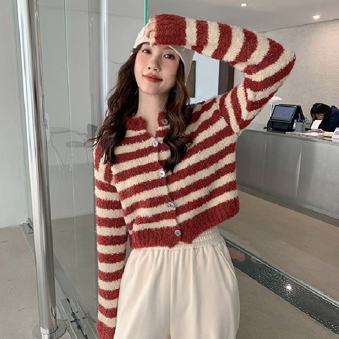 Women's chunky knit short cardigan sweater in a cozy open-front style, shown from the front on a model