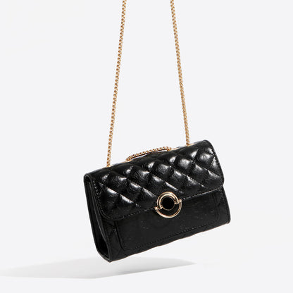 Small black PU leather crossbody bag with gold chain strap, shown from the front on a neutral background.