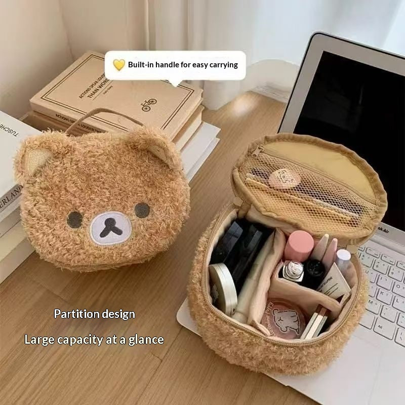 Cute oval lambswool cosmetic pouch with a 3D bear head plush design, shown as a stylish and functional makeup bag